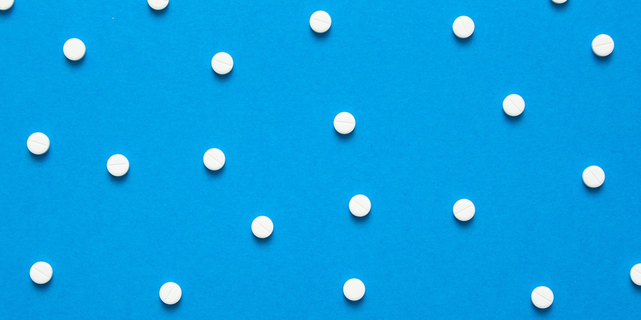 White Pills Blue Background.jpeg